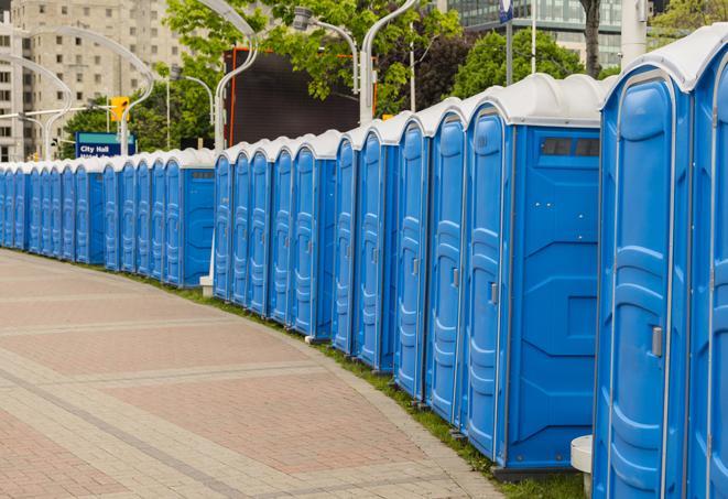 a clean row of portable restrooms for outdoor weddings or festivals in Highland